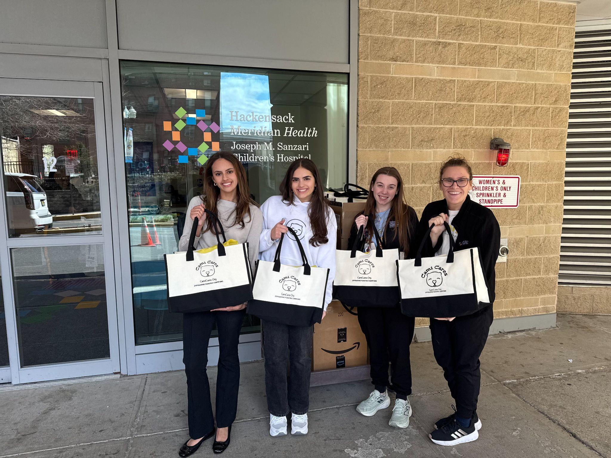 Girls with Cami Cares bags at Hackensack Meridian Health